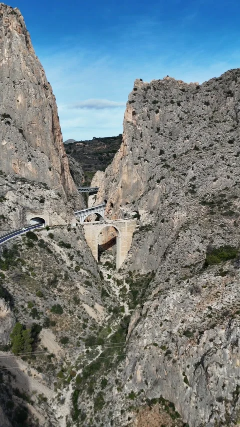 Mountain road bridge through rocky canyon in Spain Video stock 323731335