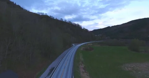 Mountain Road With A Car Passing At Sunset In Norway Stock Footage 84689273