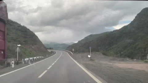 Mountain road car trip, inside window view Stock Footage 241715258