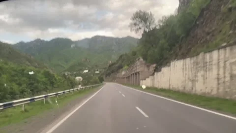 Mountain road car trip, window view Stock Footage 241715249