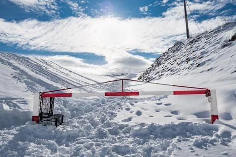 Mountain road closed by snow Stock Photos