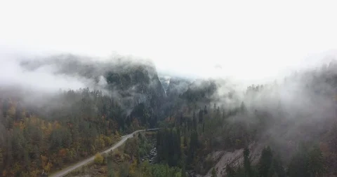 Mountain road in the clouds. Aerial Stock Footage 117768235