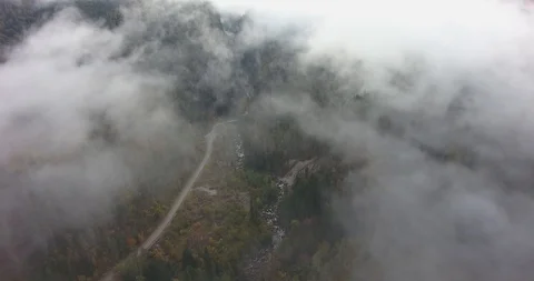Mountain road in the clouds. Aerial Stock Footage 117768457