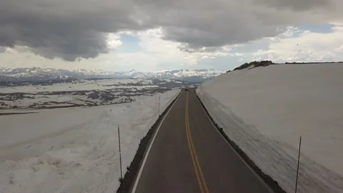 Mountain road with deep snow Stock Footage 166322613