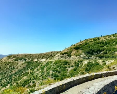 Mountain Road on a desolate landscape regrowing Fotos Stock