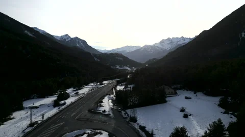 A mountain road is driven by several vehicles Stock Footage 274360347