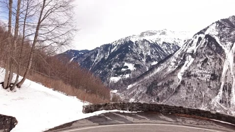 Mountain road ending into open alpine view Stock-Footage 332134718