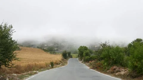 Mountain road floating in clouds Stock Footage 243836505