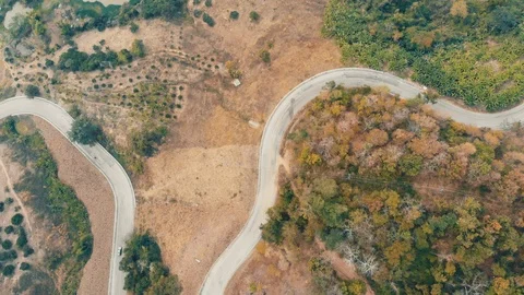 Mountain road with green tree forest aerial view transport Stock Footage 122662848