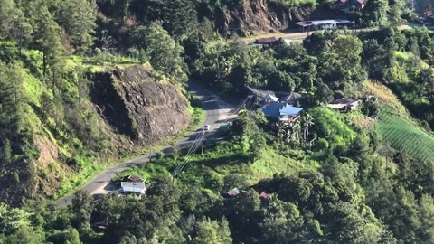 A mountain road with a house on it Video stock 278961570
