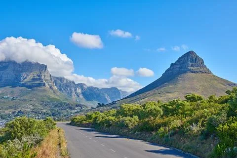 Mountain, road or peak with clouds in nature, environment or land mass stru.. Stock Photos