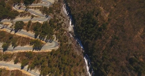 Mountain Road With A River Near It Aerial Stock Footage 84721904
