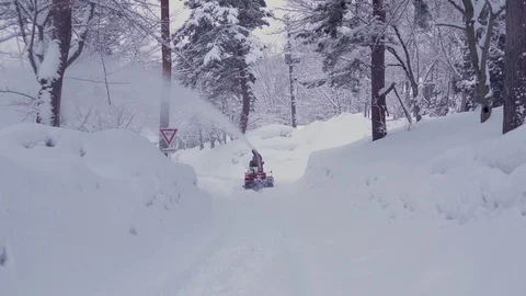 Mountain road snow plow machine Stock Footage 75574278