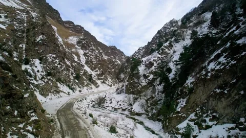 Mountain road in a snowy gorge. Stock Footage 304972964