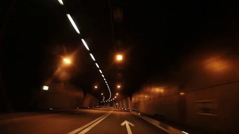 The mountain road in Switzerland at dawn. Exit from tunnel and go back. Stock Footage