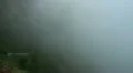 Mountain road in thick clouds 20110426 183841 HD Footage