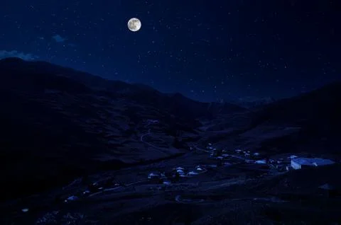 Mountain Road through the forest on a full moon night. Scenic night landscape Stock-Fotos