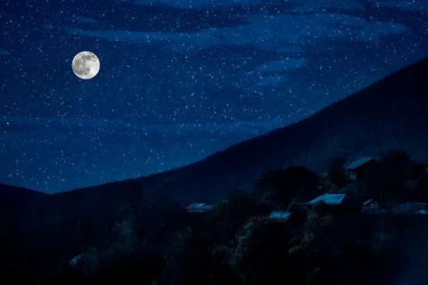 Mountain Road through the forest on a full moon night. Scenic night landscape Stock-Fotos