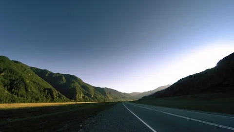 Mountain road timelapse at the summer or autumn sunset sunrise time. Wild nature Stock Footage 116380292