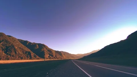 Mountain road timelapse at the summer or autumn sunset sunrise time. Wild nature Stock Footage 116381115