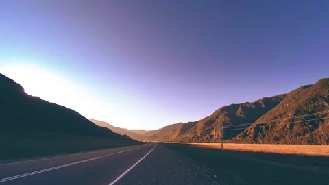 Mountain road timelapse at the summer or autumn sunset sunrise time. Wild nature Vidéo 119890416