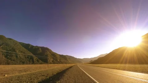 Mountain road timelapse at the summer or autumn sunset sunrise time. Wild nature Stock Footage 152580786