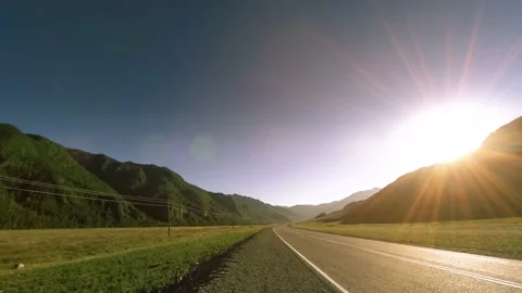 Mountain road timelapse at the summer or autumn sunset sunrise time. Wild nature Stock Footage 169649717