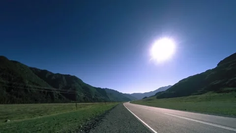 Mountain road timelapse at the summer or autumn sunset sunrise time. Wild nature Stock Footage 222509341