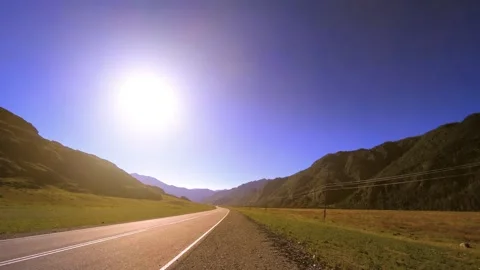 Mountain road timelapse at the summer or autumn sunset sunrise time. Wild nature Stock Footage 292899618