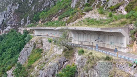 Mountain road under a rockfall protection wall in Spain. Stock Footage 326913066