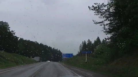 Mountain road view from the car while driving in cloudy weather handheld shot Stock Footage 86371370