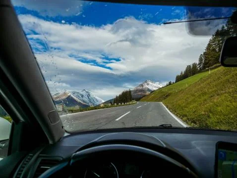 Mountain road view from the driver Stock Photos
