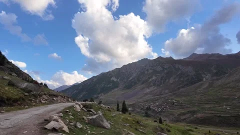 Mountain Roadside Beauty Lush Fields, Trees, Houses, and Towers Along Stock Footage 286422625
