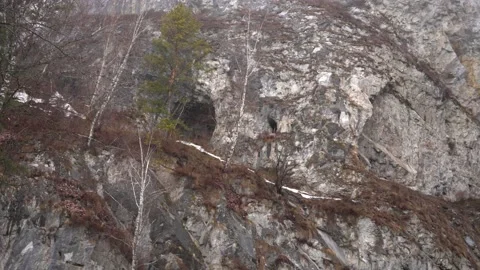 Mountain rocks with caves Video stock 236569941