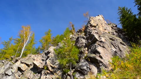 Mountain rocks, trees landscape on blue sky. Calm natural scene. 库存影片 253216468