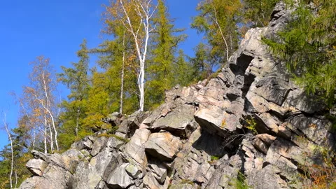 Mountain rocks, trees landscape on blue sky. Calm natural scene. 库存影片 253216564