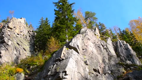 Mountain rocks, trees landscape on blue sky. Calm natural scene. 库存影片 253216661
