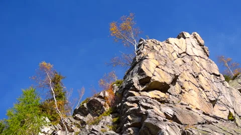 Mountain rocks, trees landscape on blue sky. Calm natural scene. Stock Footage 253216688