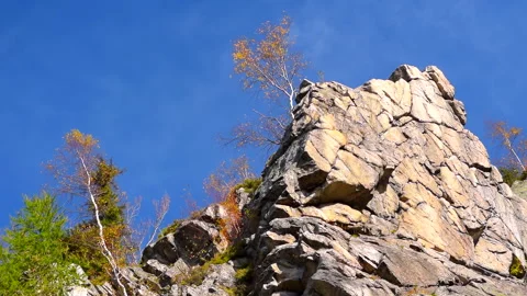 Mountain rocks, trees landscape on blue sky. Calm natural scene. Stock Footage 253216713