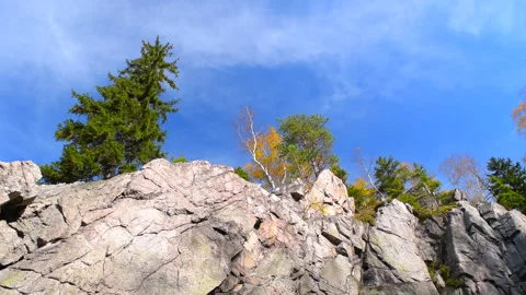 Mountain rocks, trees landscape on blue sky. Calm natural scene. 스톡 동영상 253216867