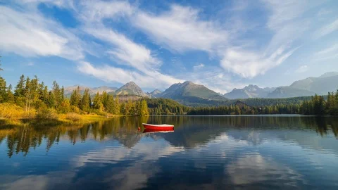 Mountain scene with mountain hotel next to a lake Stock Footage 95941526