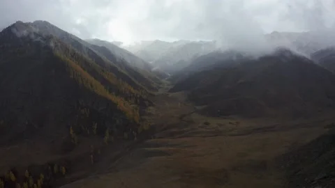 Mountain scenery with cloudy weather and snow. Stock Footage 220034045