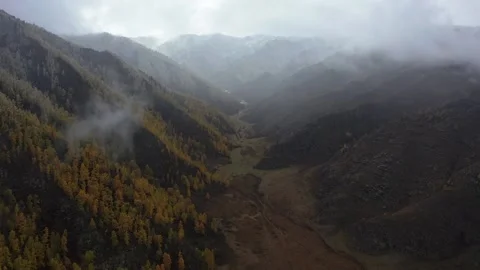 Mountain scenery with cloudy weather and snow. Stock Footage 220034064
