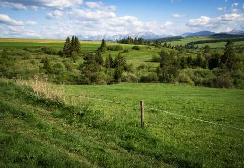 Mountain scenery with meadows Stock Photos