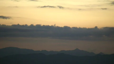 Mountain scenic with clouds drifting overhead at dawn (High Definition) Stock Footage 359916