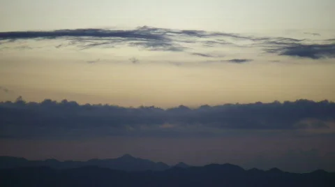 Mountain scenic with clouds drifting overhead at dawn (High Definition) Stock Footage 359917