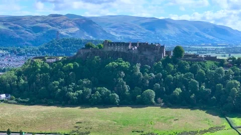 A mountain with a Scottish castle on top Stock Footage 306625122
