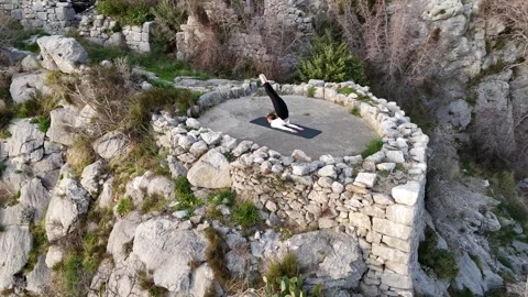 Mountain Serenity: A Drone's View of Yoga Amidst Nature Stock Footage 265150688