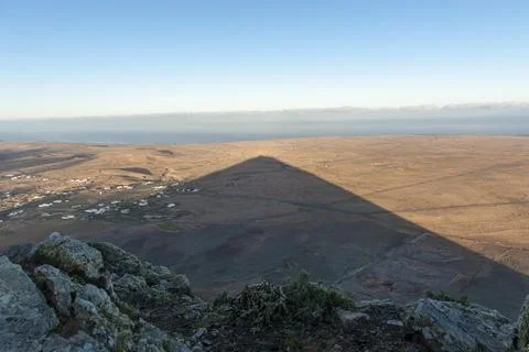 Mountain shadow in the shape of a triangle in the landscape triangle morning 스톡 사진