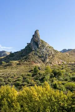 A mountain in the shape of a hat under the blue sky called picuero in Molino Stock Photos